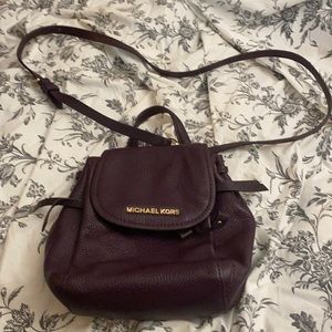 Mickeal Kors mini backpack purse, mauve colour size small